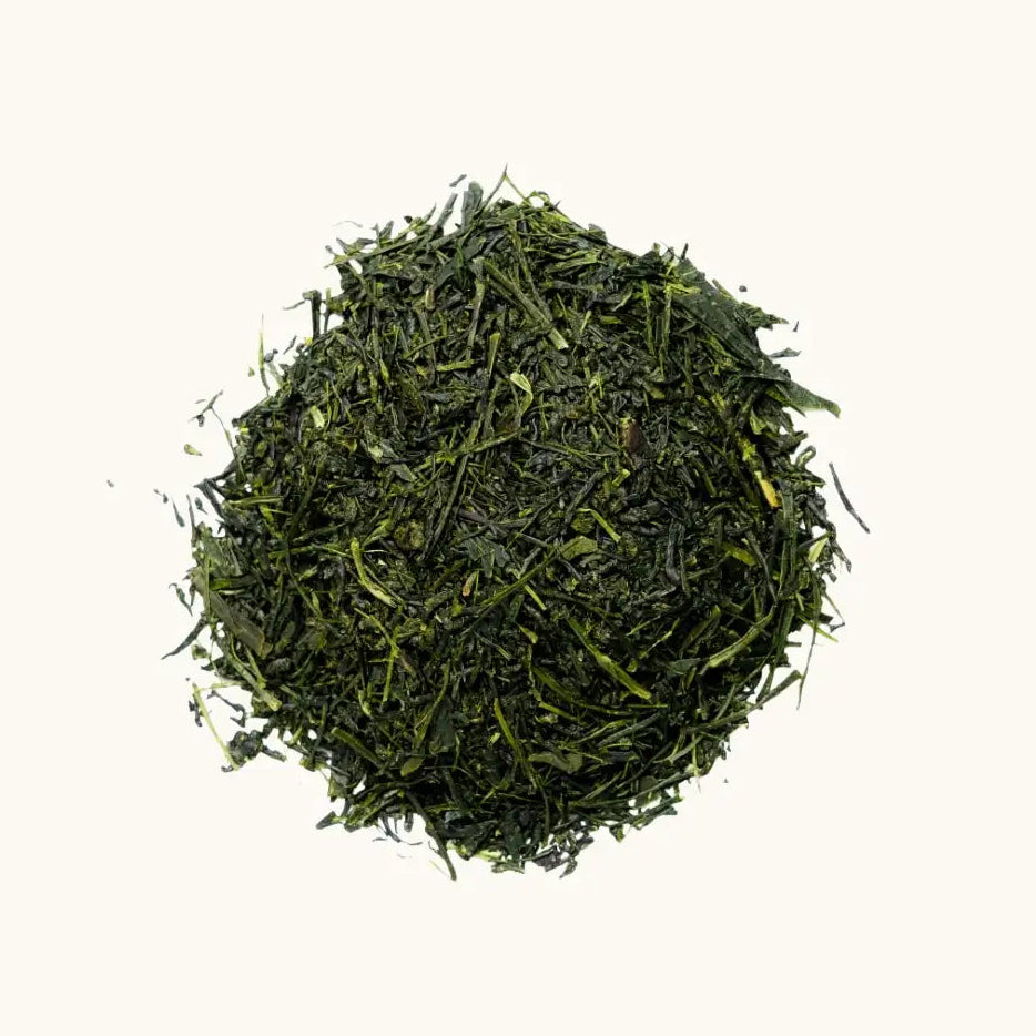 A pile of shaded-grown Japanese tea Kabusecha on a beige background