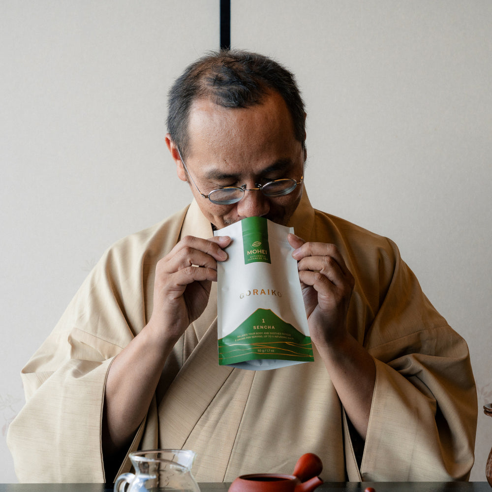 Our tea master Honda Mohei, smelling its fresh Sencha, in his traditional tea ceremony kimono.