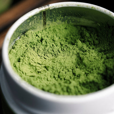 Close-up of the inside of a tin can with matcha powder.