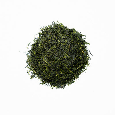 A pile of Kabusecha green tea leaves on a white background