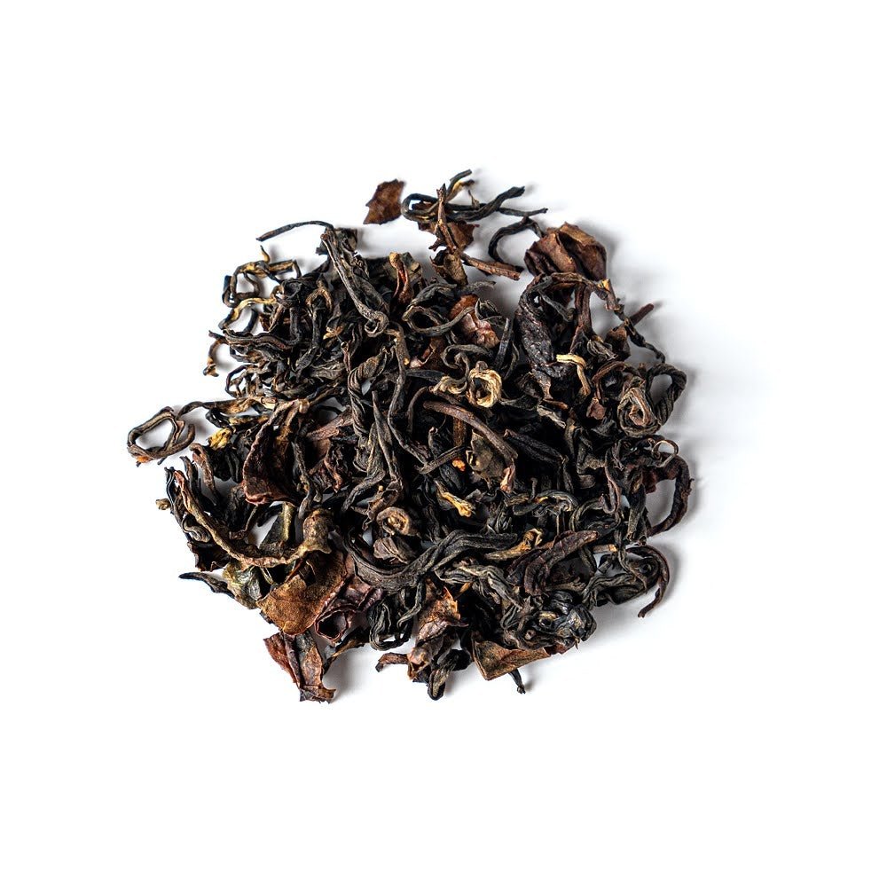 Japanese Black Tea leaves made by Toshifumi Shibamoto on a white background.