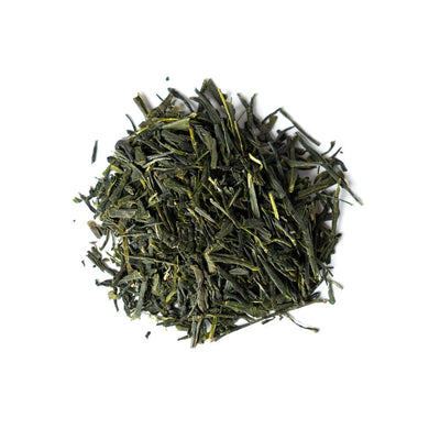 A pile of Sencha green tea leaves on a white background
